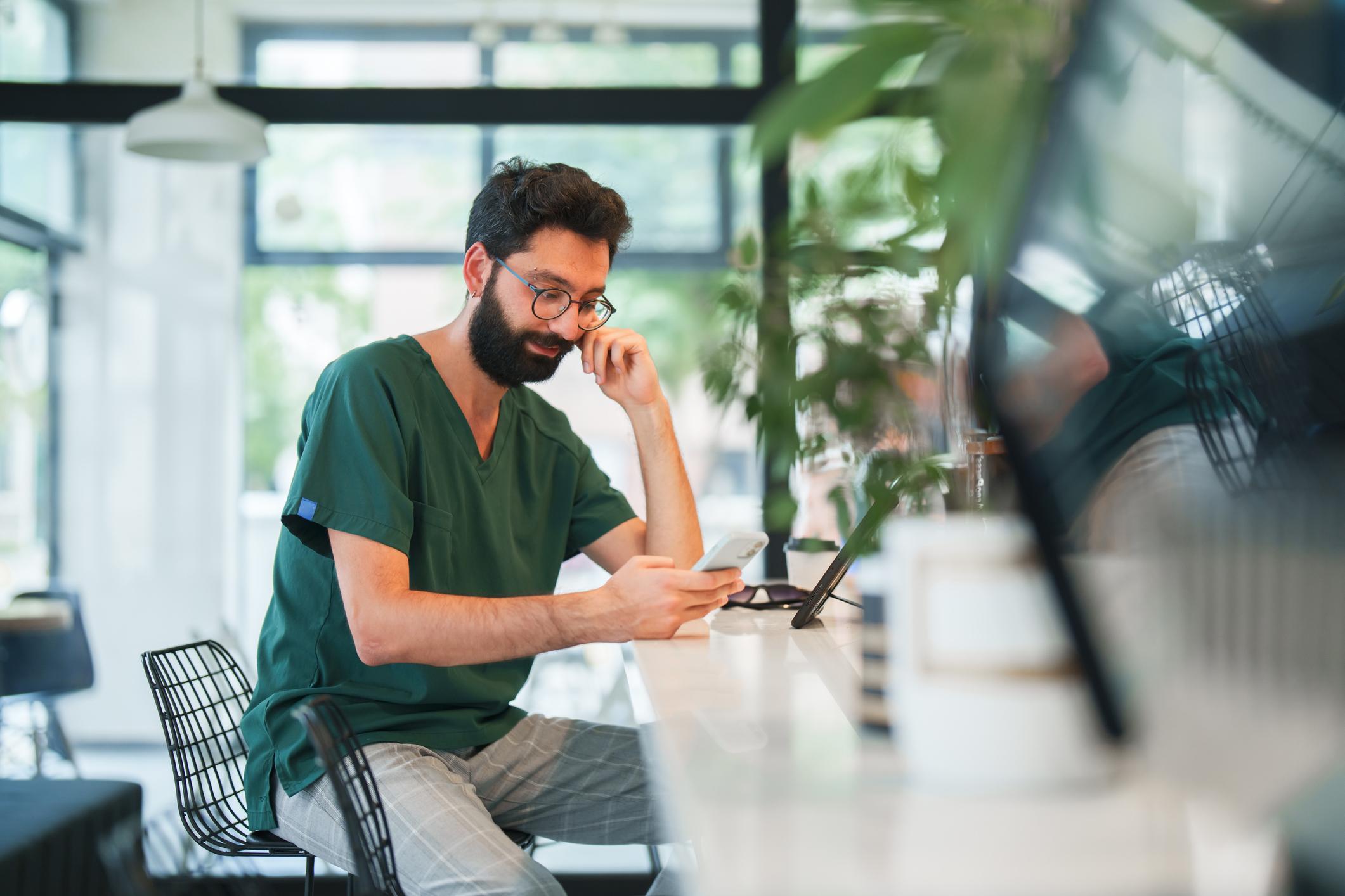 man looking at cell phone